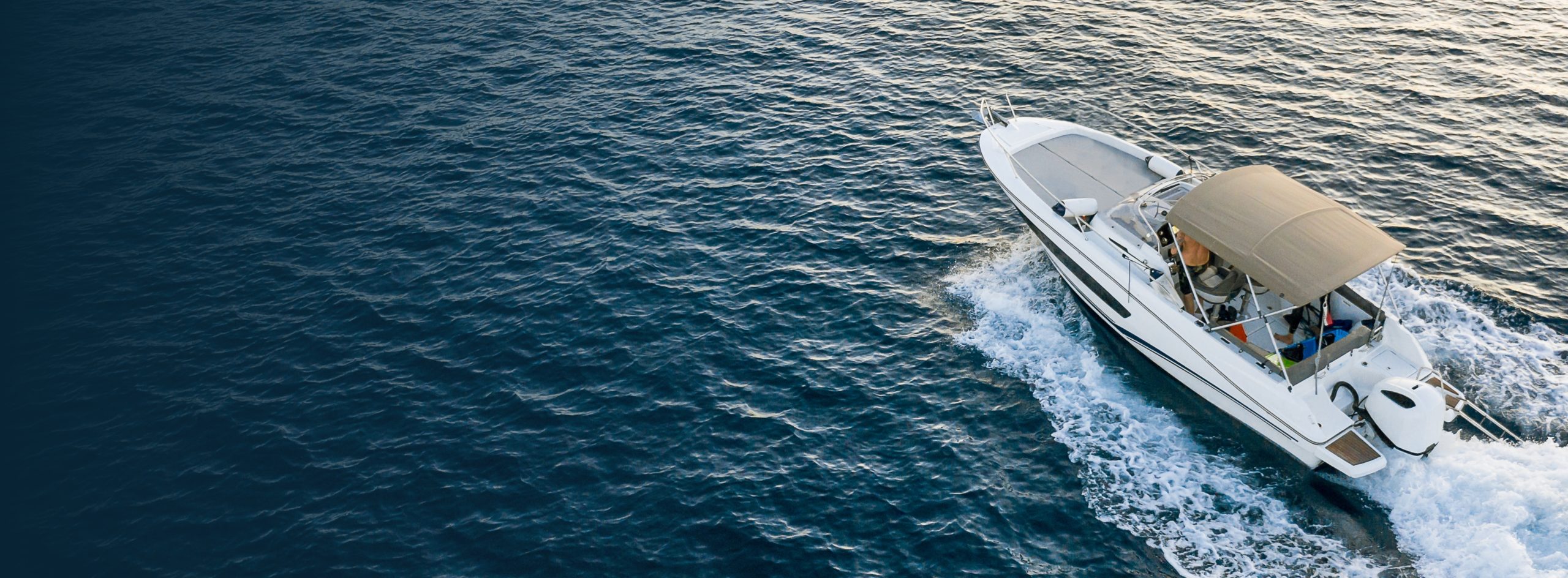 white boat boating through the water