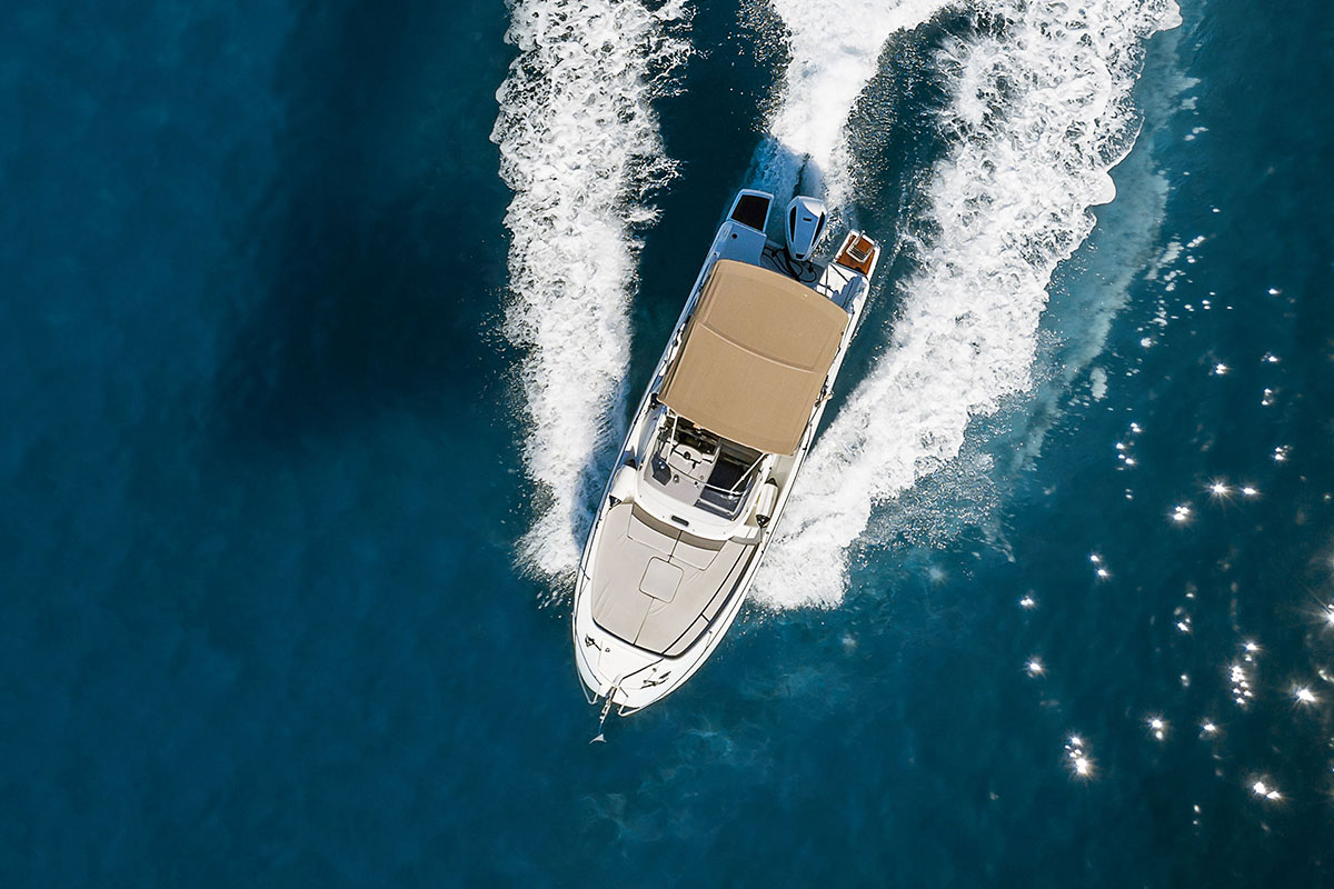 white boat in blue waters