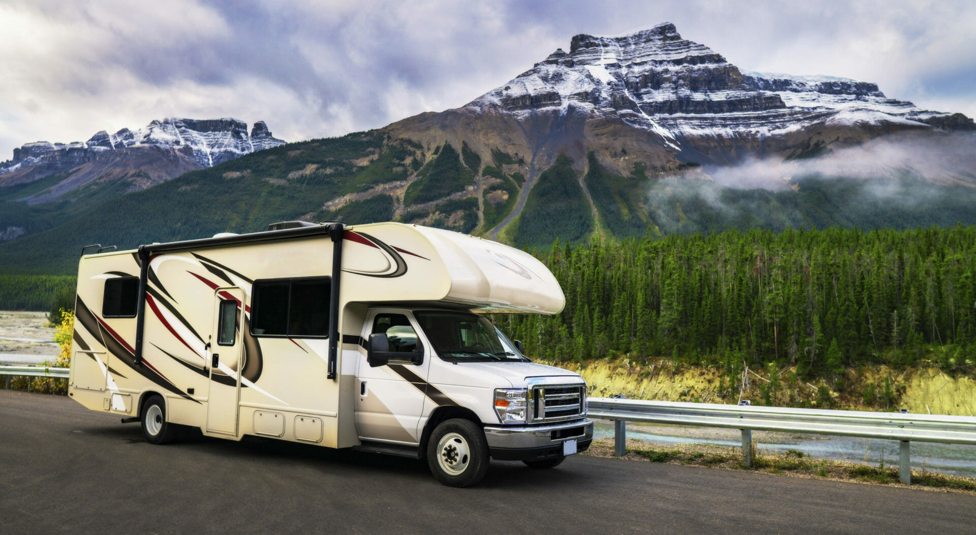 RV driving by mountains